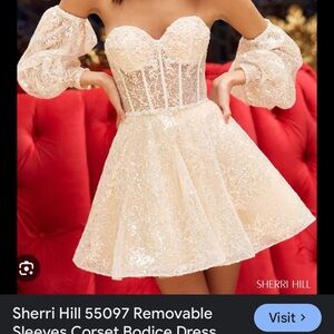 Woman’s size 0 Sherri Hill dress with detached sleeves.